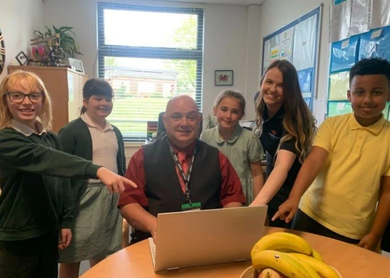 Pupils from Asterdale Primary with headteacher David Evans and Jo Fearn from L.E.A.D. IT Services