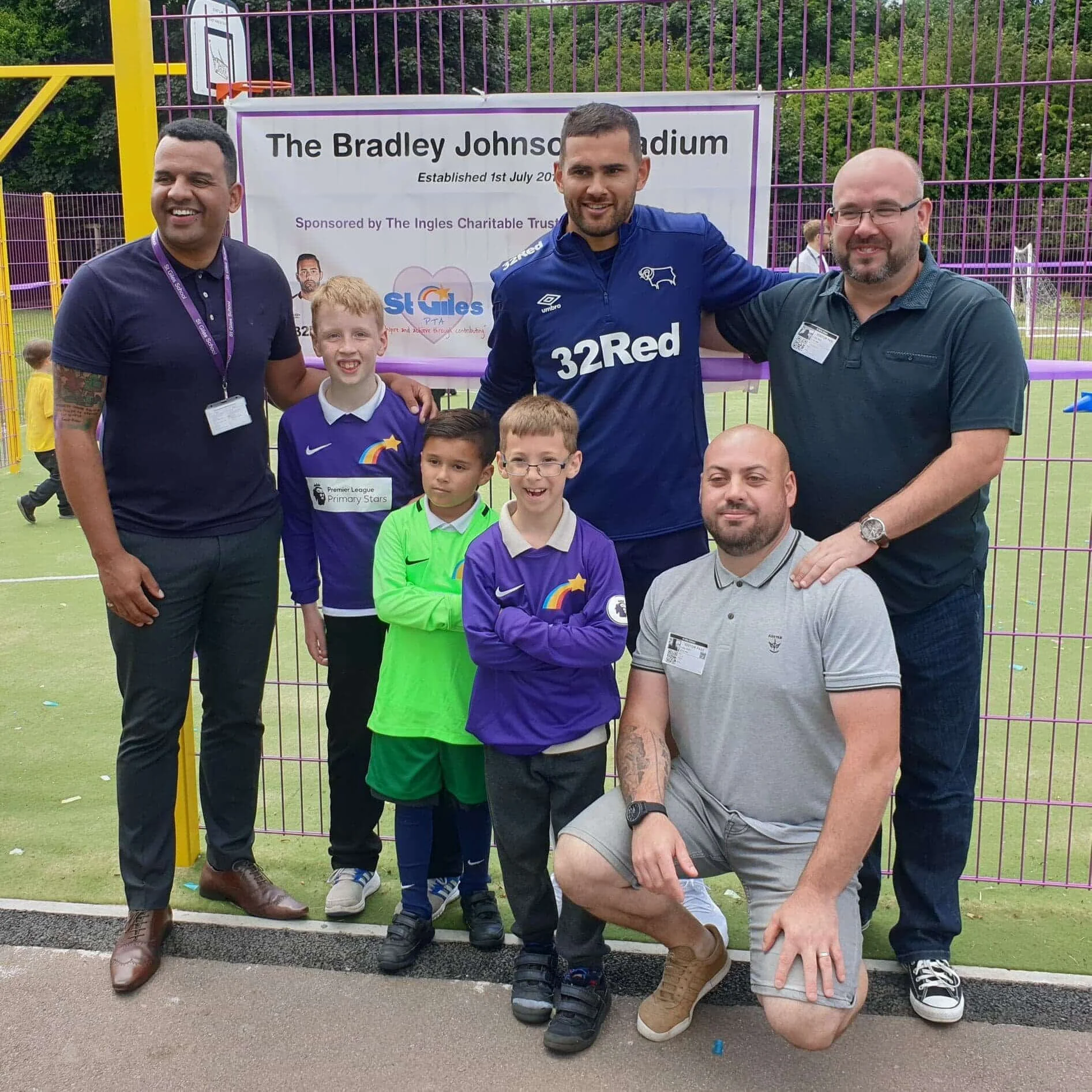 Clive Lawrence with former Derby County midfielder Bradley Johnson and the St Giles School PTFA at the opening of the Multi Use Games Arena in 2019