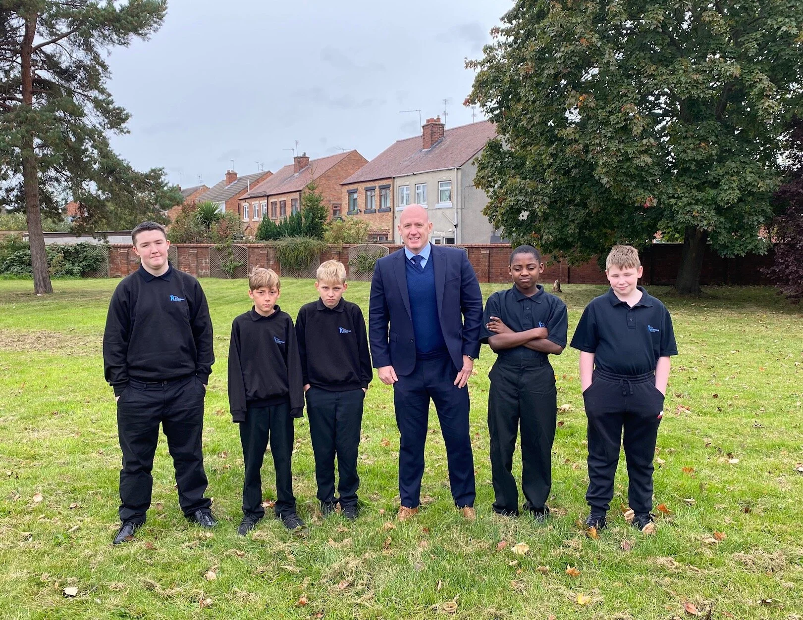 Pupils of Kingsmead School show off their new uniform, which has brought them a sense of unity.