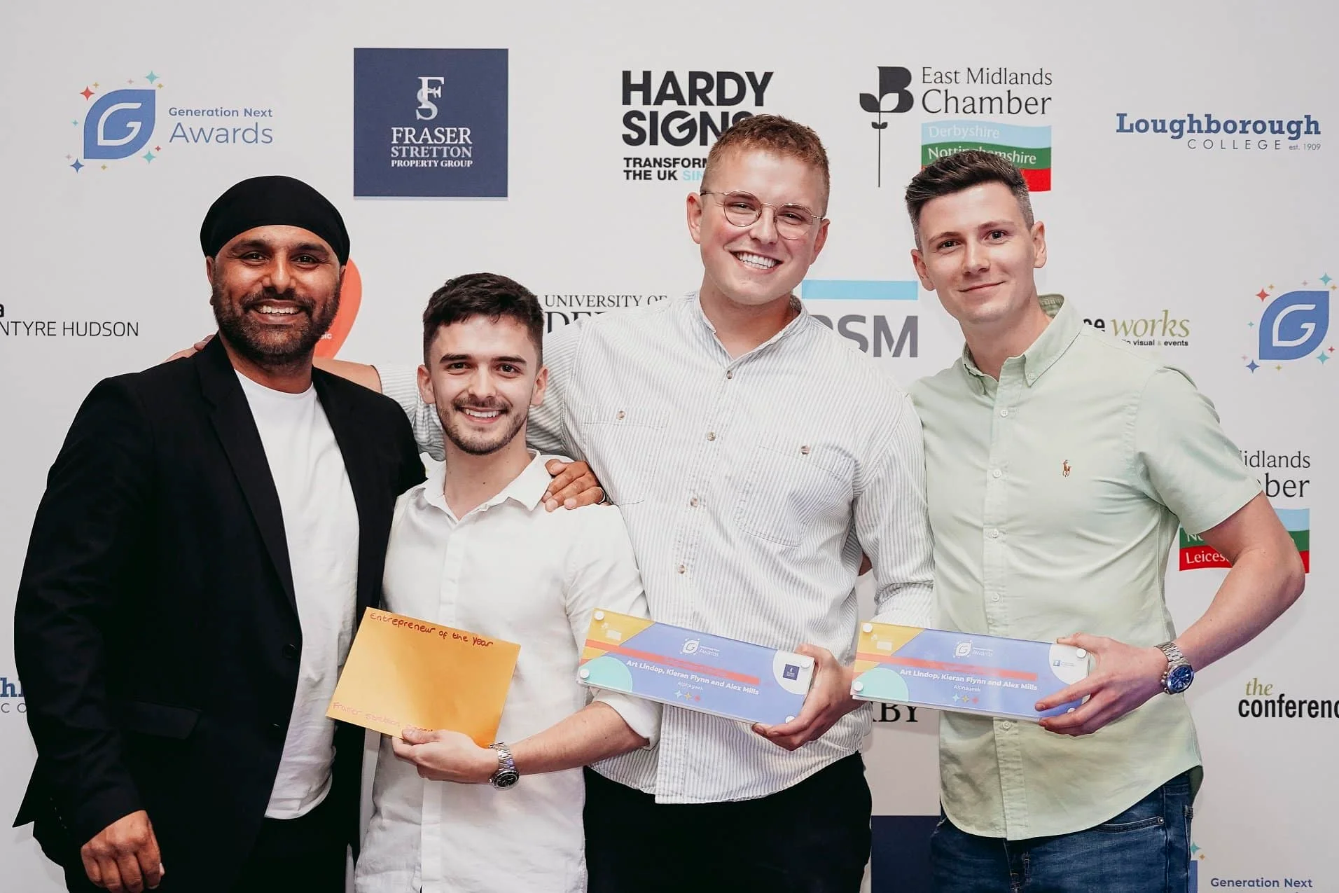 Narinder Nijjar, from sponsors Fraser Stretton, presents the Generation Next Entrepreneur of the Year award to Alex Mills, Art Lindop and Kieran Flynn, from Derby digital marketing agency Alphageek.