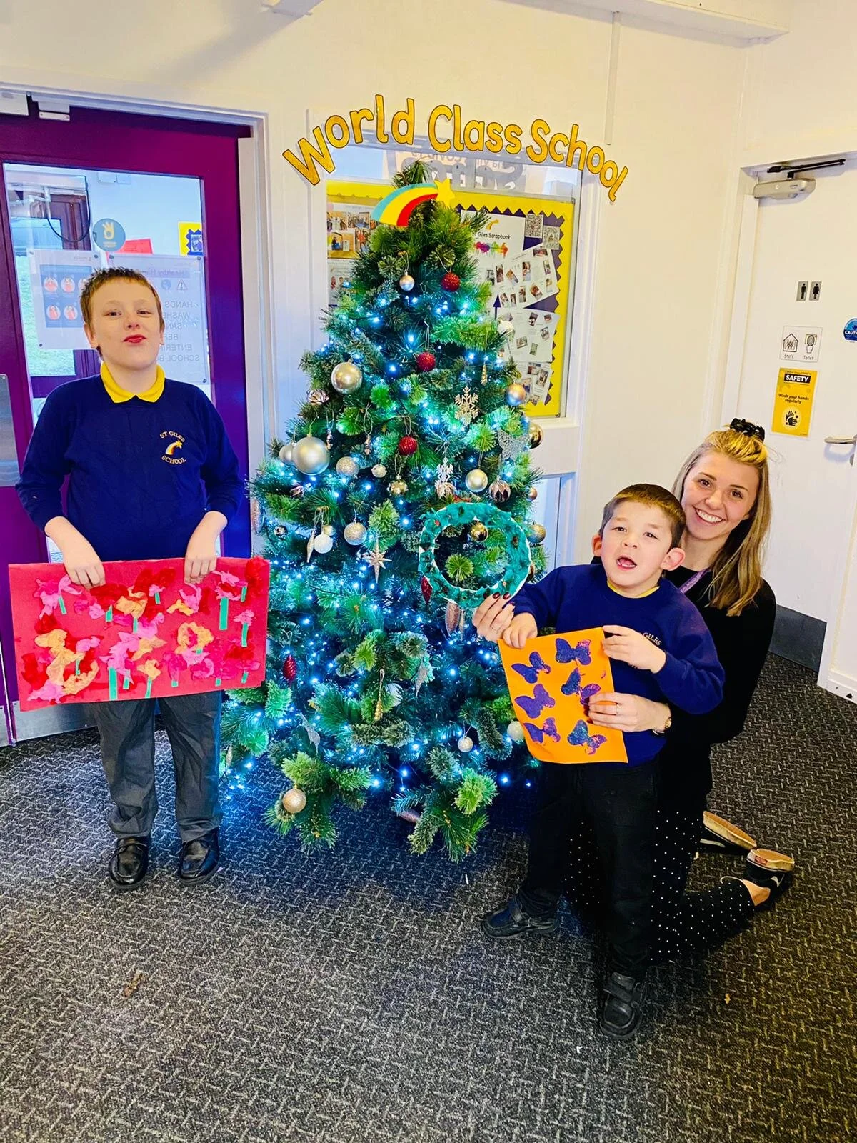 St Giles School pupils show off their hand-crafted Christmas cards for Douglas Court Care Home.