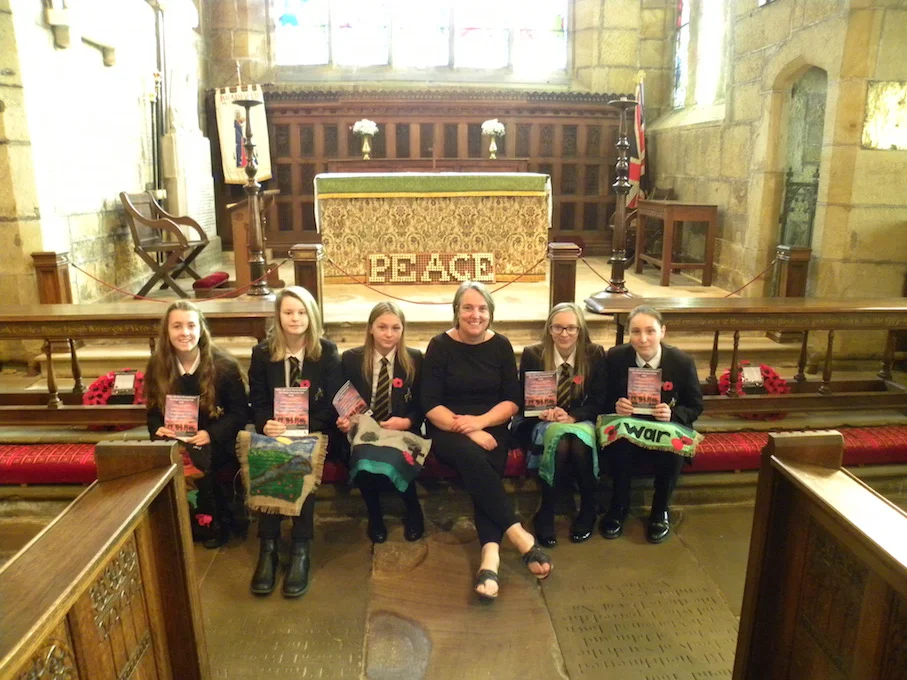 From left: Emily Busby, Freya Bull, Kayley Grindrod, Mrs Sally Laughton, Katie Martin & Jess Banks with the tapestries presented to St Nicholas' Church as part of their Poppy Memorial Trail to mark 100 years since the end of the First World War. Pen…