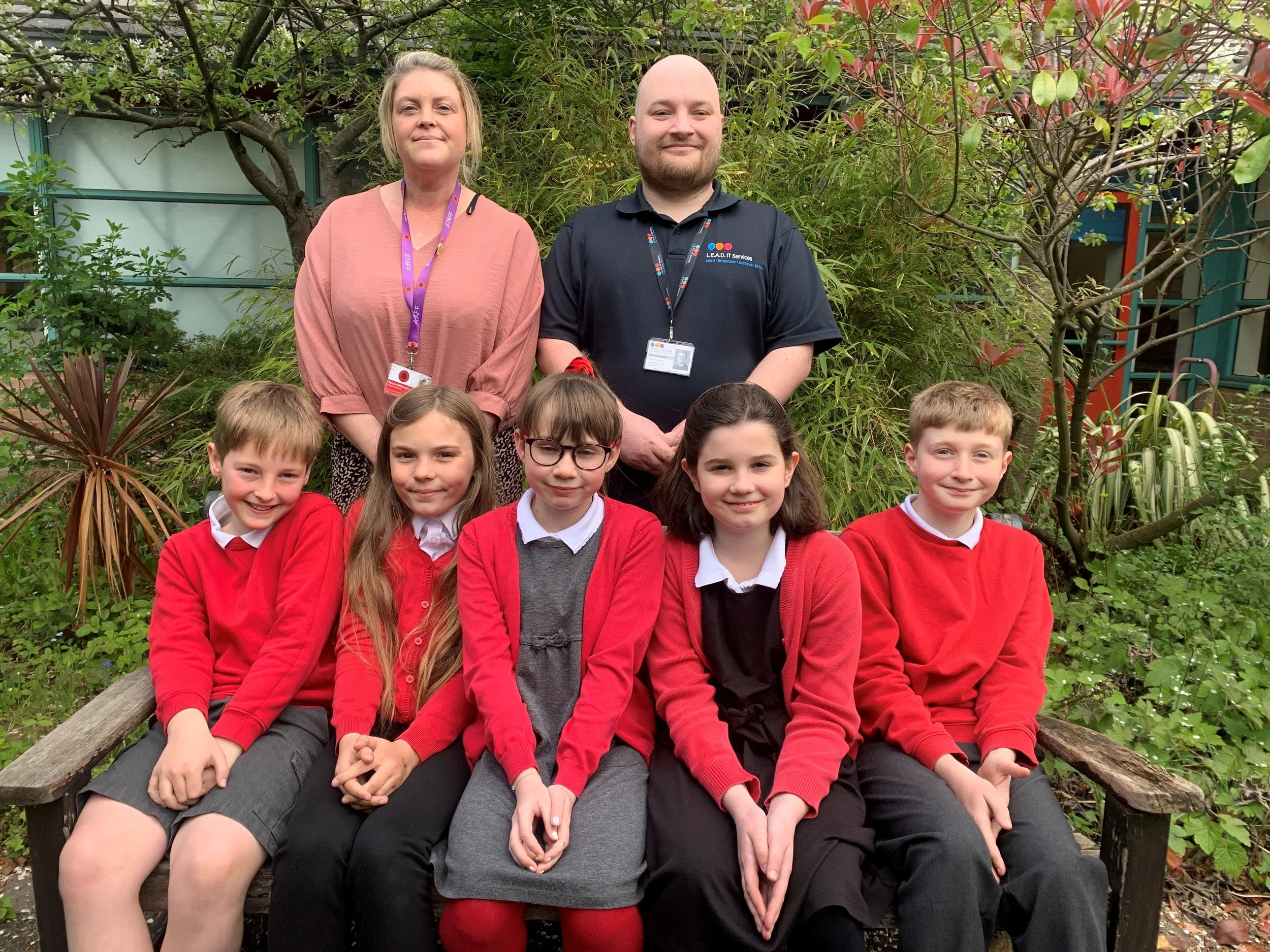 Emma Wilkinson, headteacher of Portway Junior School and pupils, with Dan from L.E.A.D. IT Services