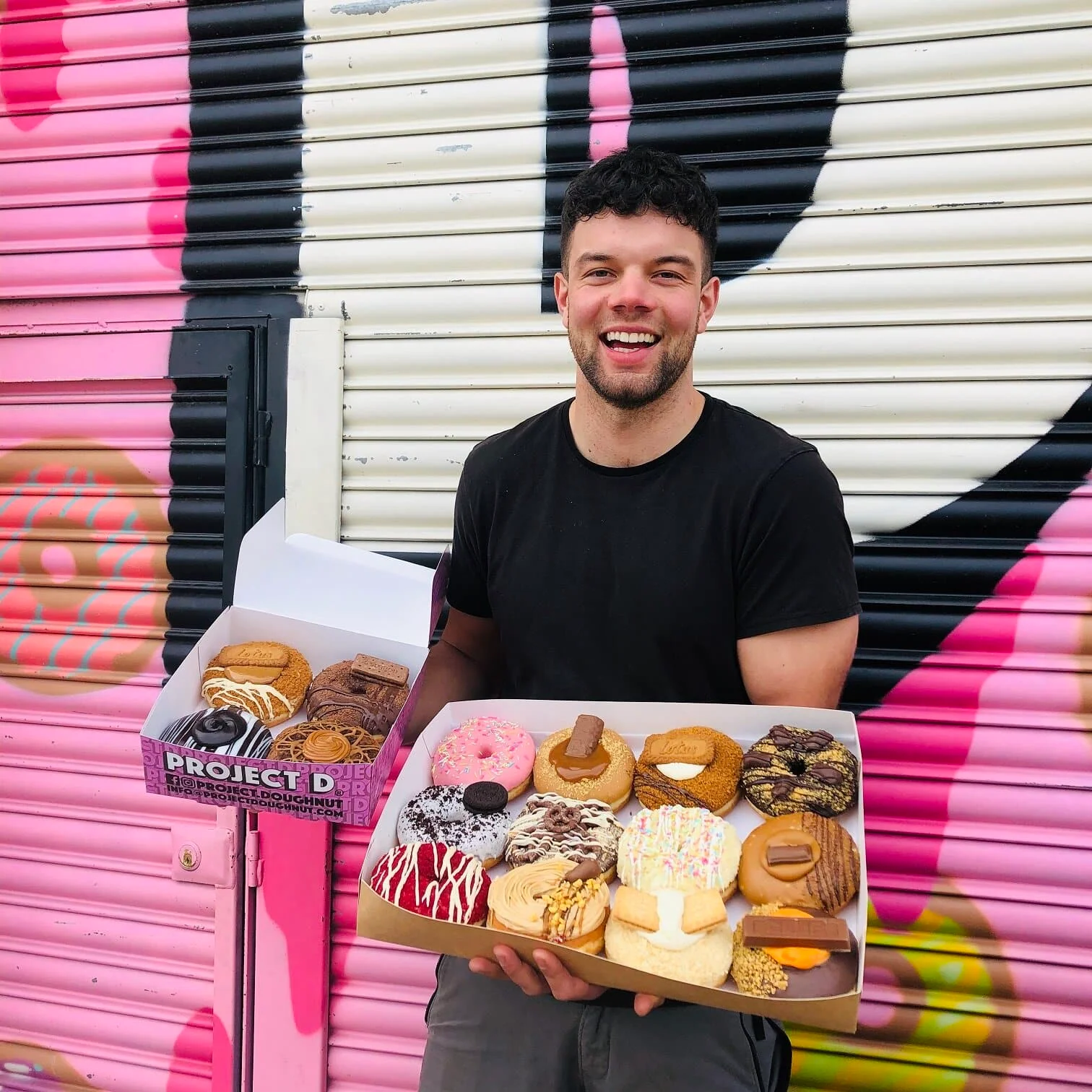 Co-owner of Project D Matthew Bond shows off some of the bakery’s delicious doughnuts.