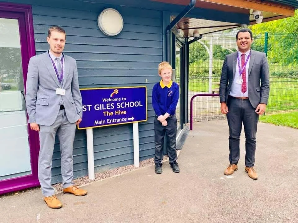 St Giles School's new assistant head teacher Tom Few (far left) with pupil Ben and executive head teacher Clive Lawrence.