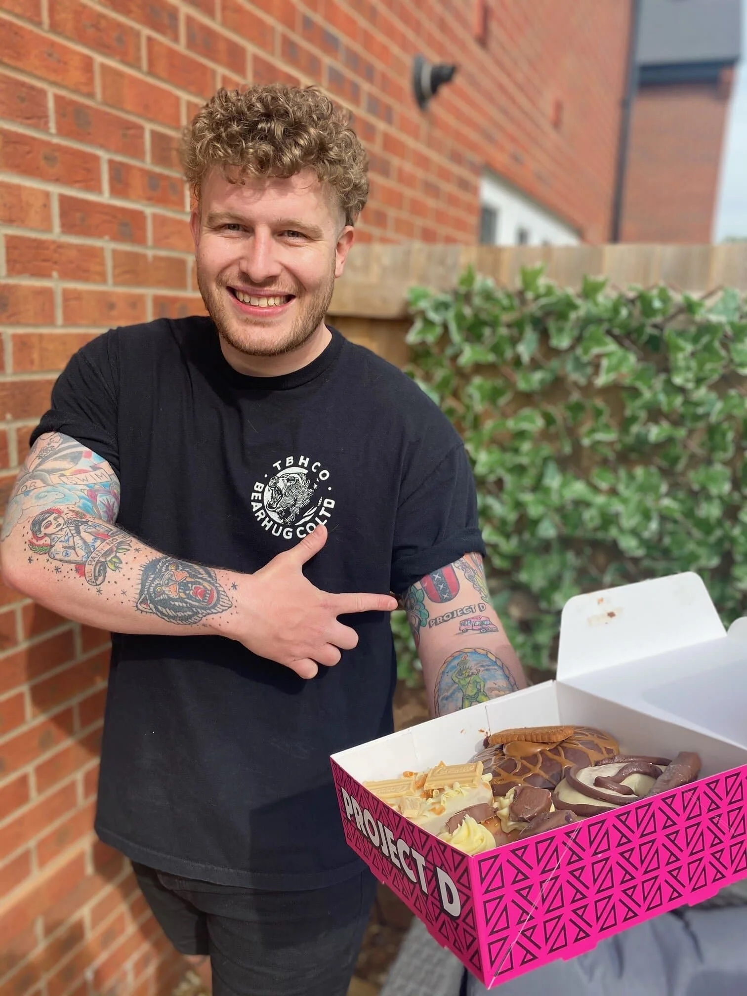 Tony Day has been rewarded with a lifetime’s supply of delicious doughnuts after getting a tattoo inspired by his favourite bakery, Project D.