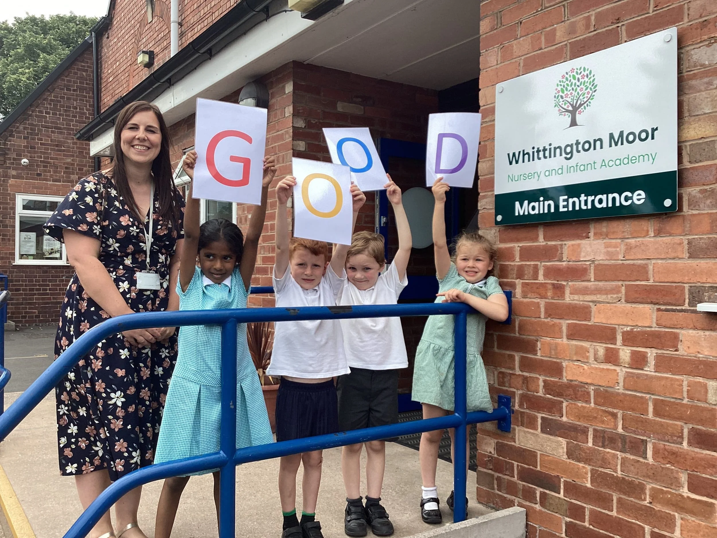 headteacher Lauren Kay with pupils from the school.