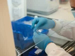 Lab worker using a testing kit