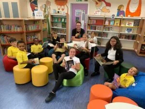 Author Matt Beighton with pupils of The Bemrose School in the new library