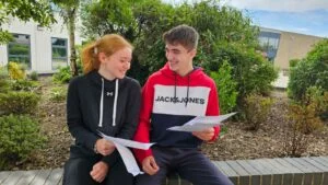 Rosie Millward and Lucas Cocker compare grades at Long Eaton School