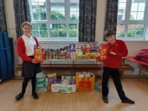 Pupils at Horsley Woodhouse Primary School have been collecting donations for Salcare. Picture shows head girl and head boy with table of donations.