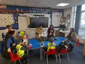 Children working with firefighters at Royal School for the Deaf Derby