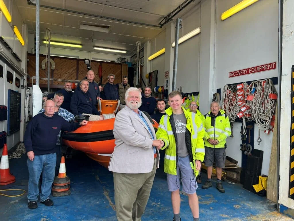 Rail maintenance firm MTMS boss Malcolm Prentice meets Freshwater Independent Lifeboat volunteers