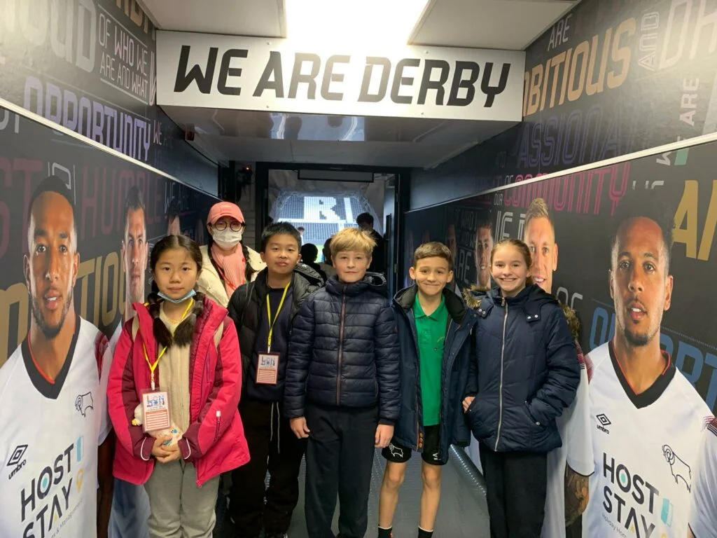 Children from Springfield Primary School and two primary schools in China stand in the tunnel at Derby County Stadium