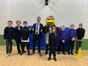 Baggy Bird with co-headteacher Sam Wood and pupils at Queen’s Croft High School