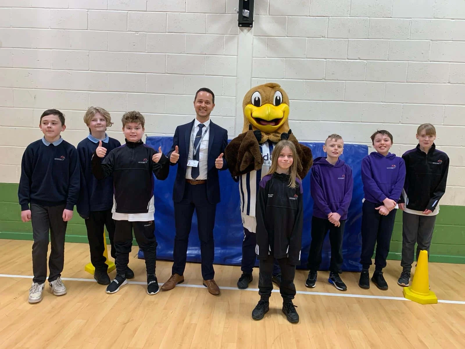 Baggy Bird with co-headteacher Sam Wood and pupils at Queen’s Croft High School