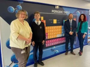 Diana Whitmill, Marko Deksnis, Paul Burrows and Claire Hollingshurst with the periodic table