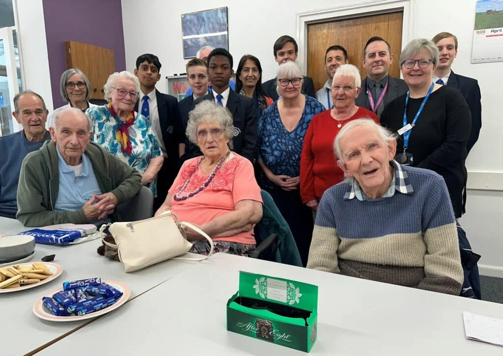 Tech-savvy students from Murray Park School with the Mickleover pensioners.