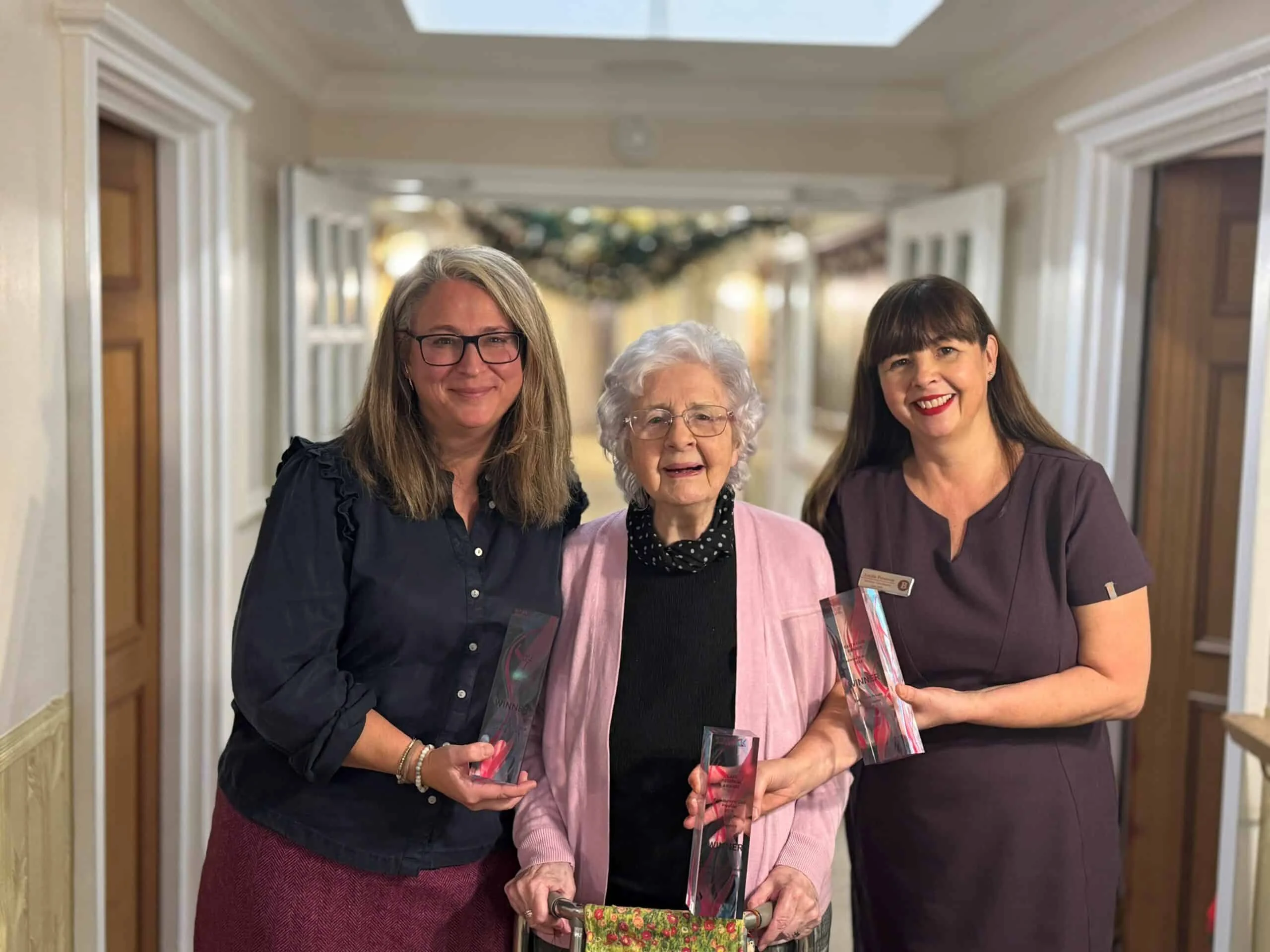 Celeste Turner and Lucille Parsisson from Brookfields with 95-year-old resident Muriel Davis