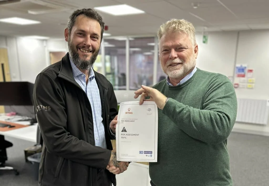 Health and safety expert Ian Casswell, right, who has joined Midlands rail firm MTMS as its new HSQE manager, hands the company's project support Nik Merchant his risk assessment certificate.