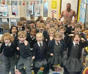 Zack George aka Steel with pupils from William Gilbert Primary School