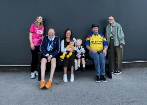 The Marson family on the TDP bench at Derby County Football Club with Kym Barlow from TDP, with nephew Finley and son Freddie, and Sophie Roddie from the club.