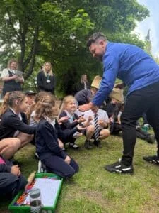 TV gardening Lee Connelly, aka the Skinny Jean Gardener, hands out compost balls at Royal School for the Deaf Derby.